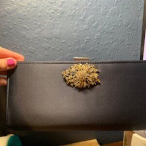 Black evening purse with silver diamond broach
